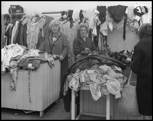 two woman behind the counter